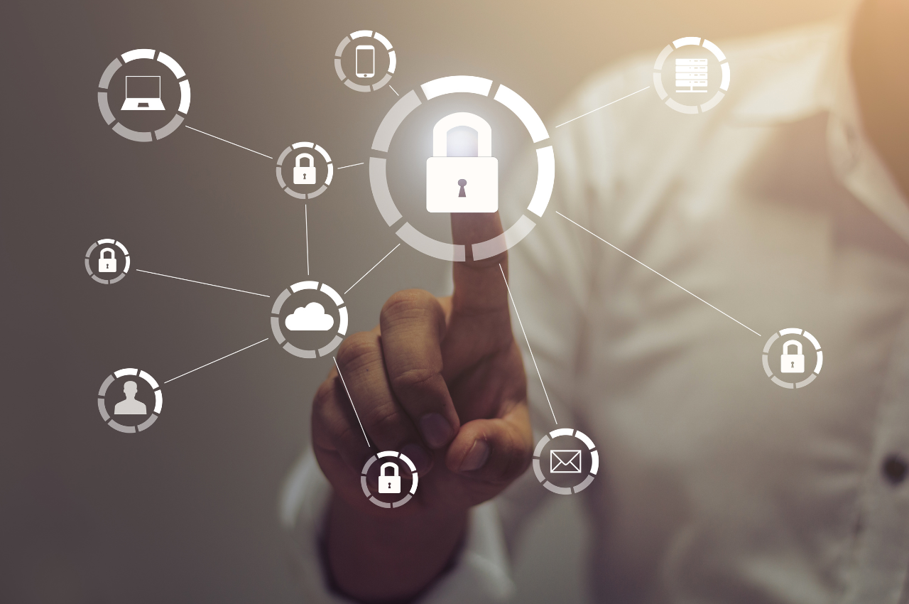 cybersecurity in financial transactions - image of hand hovering over lock connected to other technical icons