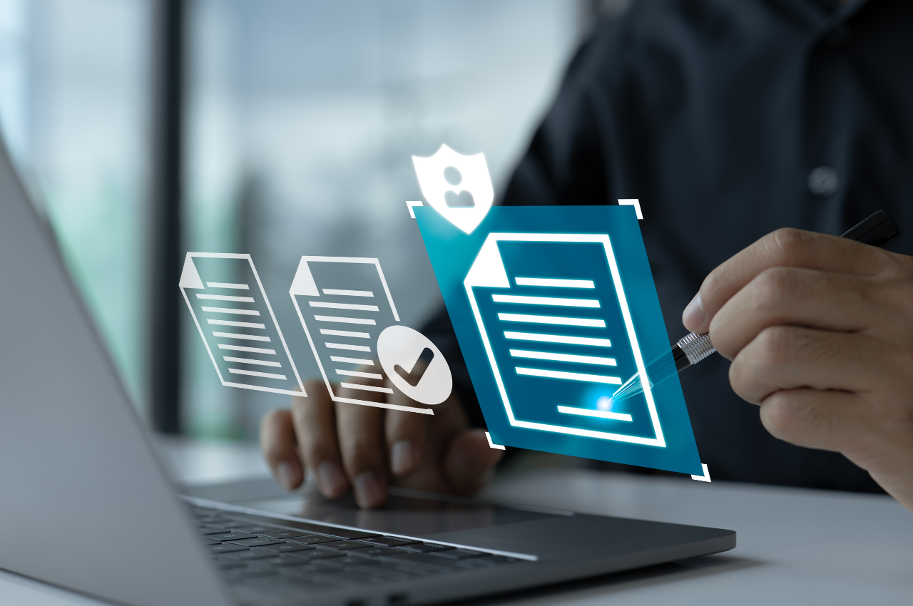 smart contracts and blockchain - image of someone signing a virtual document at their laptop